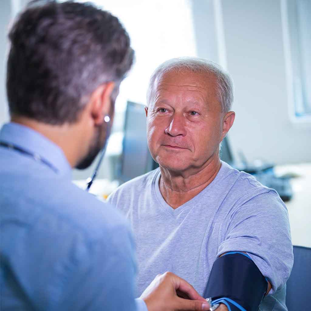 Physician checking a patient's blood pressure