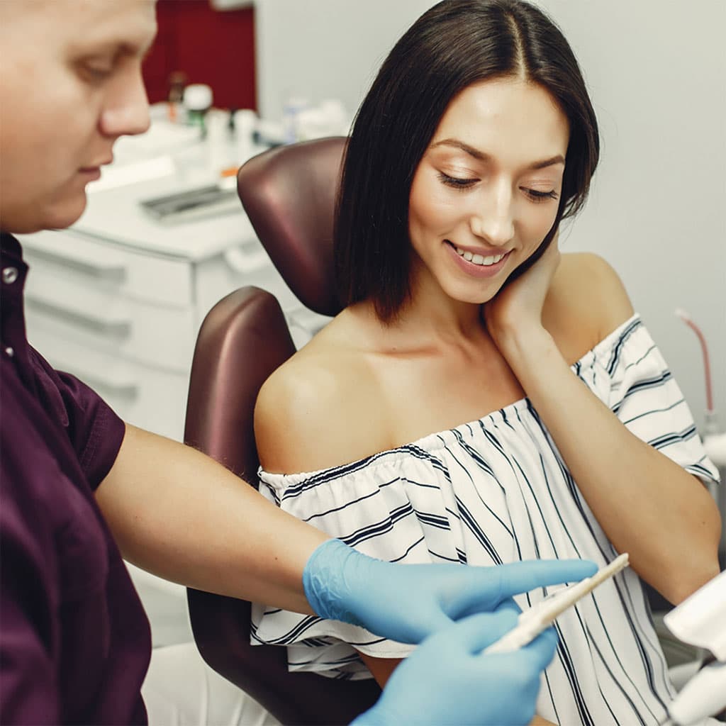 Patient smiling during a clinical examination